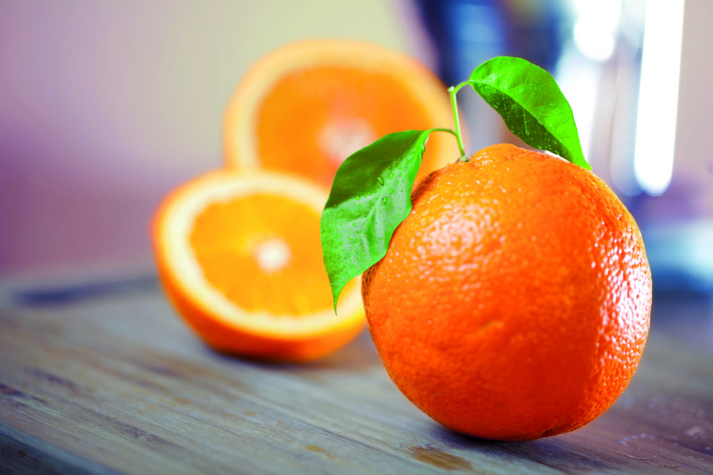 orange with green leafs and two slides of orange behind