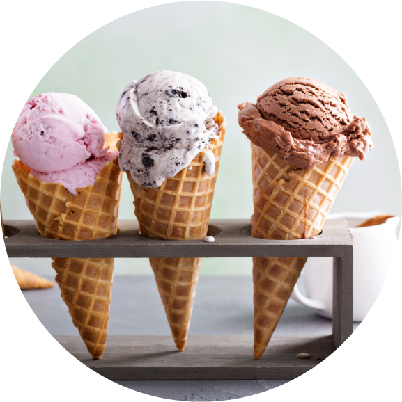 Three cones with a scoop of colourful ice cream